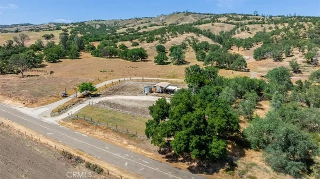 a bathroom with a granite countertop shower and a sink