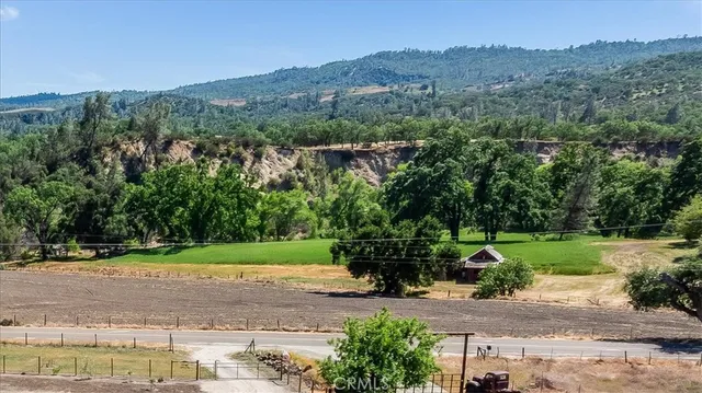 a view of a backyard with table and chairs