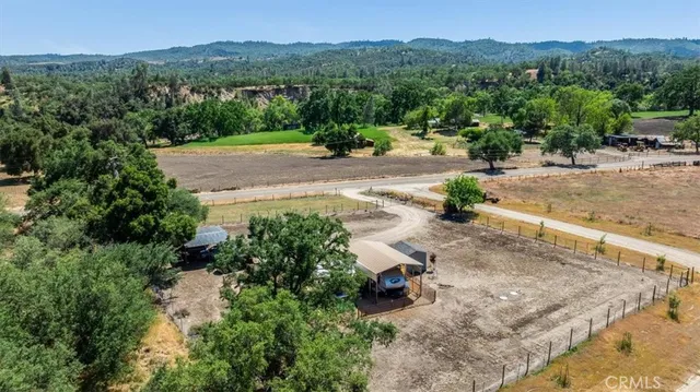 an aerial view of a house with a garden