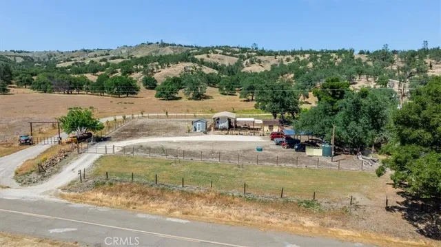 a view of a swimming pool with a yard