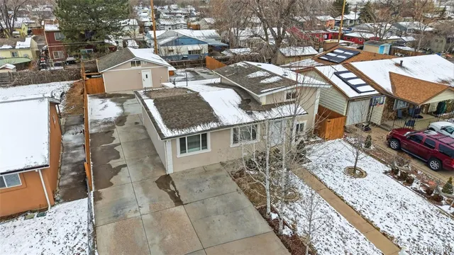 an aerial view of a residential apartment building with a yard