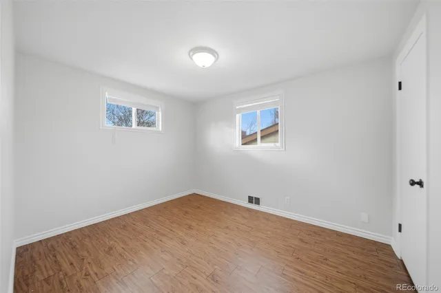 a kitchen with stainless steel appliances a refrigerator and a stove top oven
