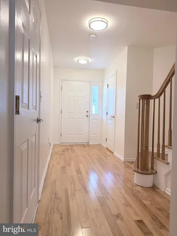 a view of entryway with wooden floor