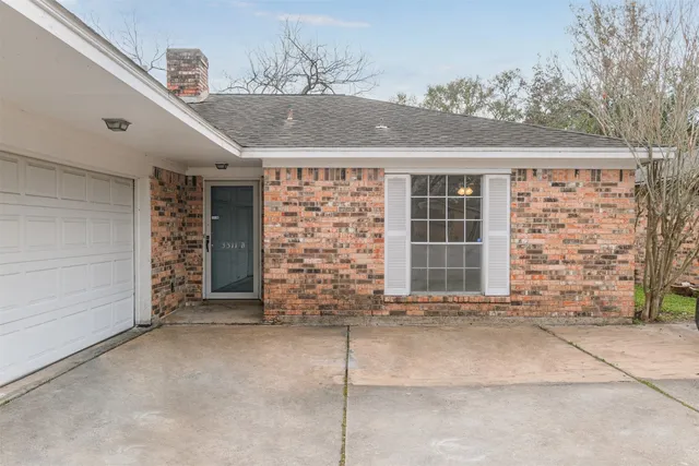 a front view of a house with a garage