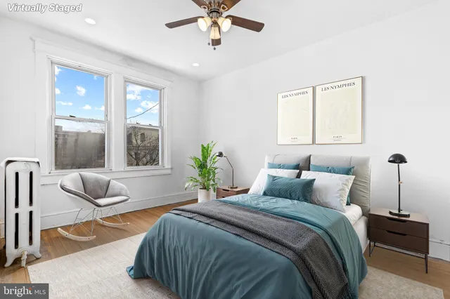 a bedroom with a bed and a couch