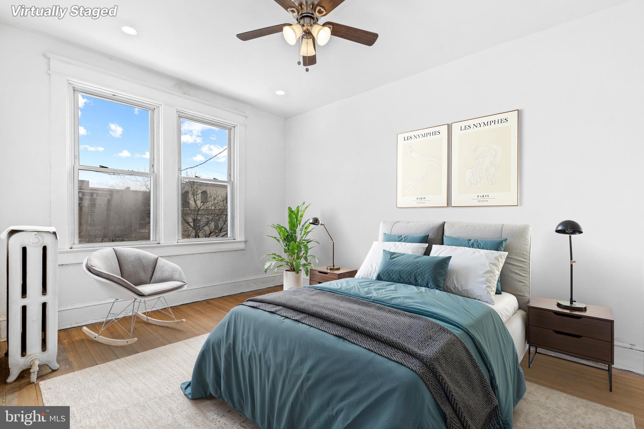 5506 8th Street Northwest Washington, DC 20011 - Photo 3 of 26 a bedroom with a bed and a couch