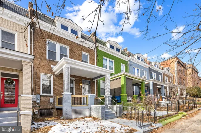 a view of a building with a street