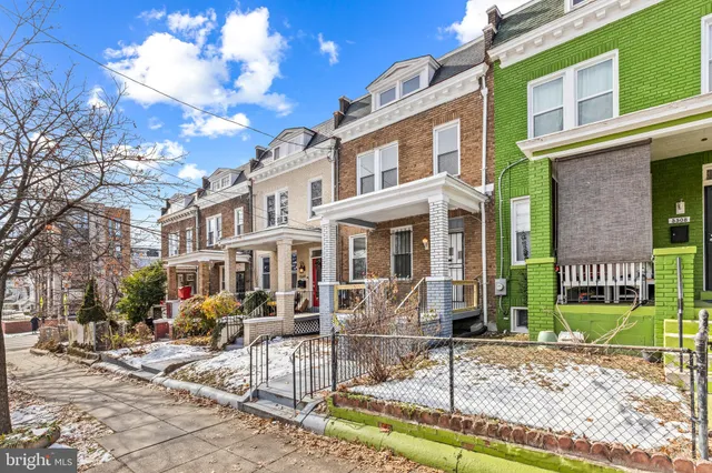 a view of a building with a yard