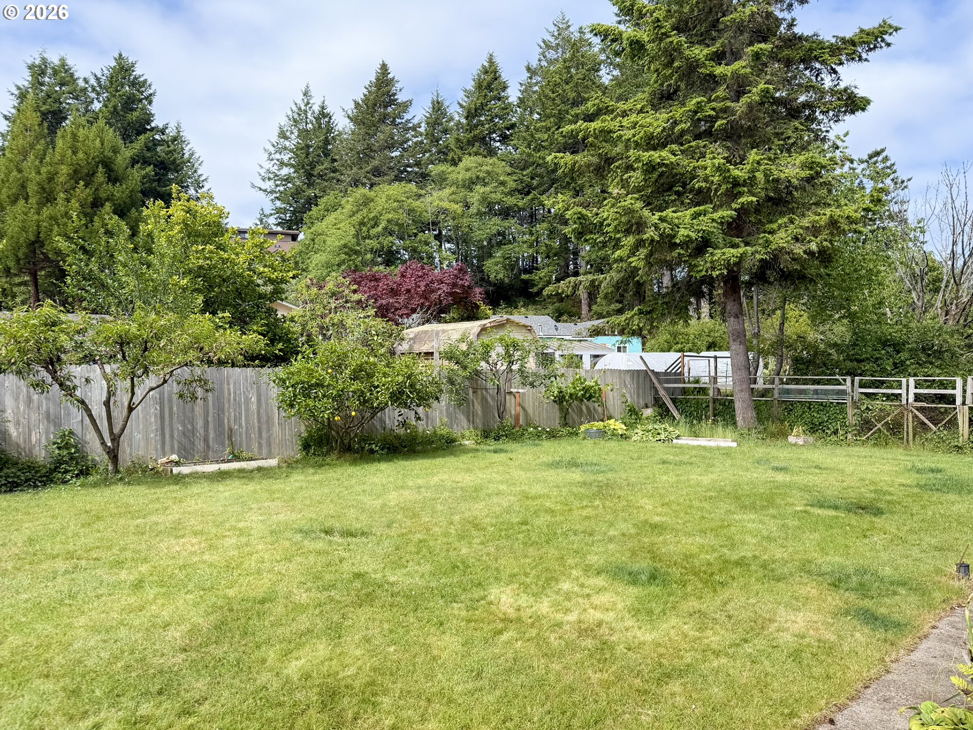 1372 Hampton Road Brookings, OR 97415 - Photo 33 of 42 a backyard of a house with lots of green space