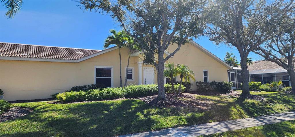 3701 Albacete Circle, Unit 98 Punta Gorda, FL 33950 - Photo 1 of 1 a view of a house with a tree in a yard