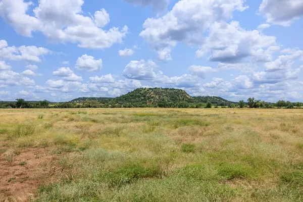 a view of a lake and mountains in the background