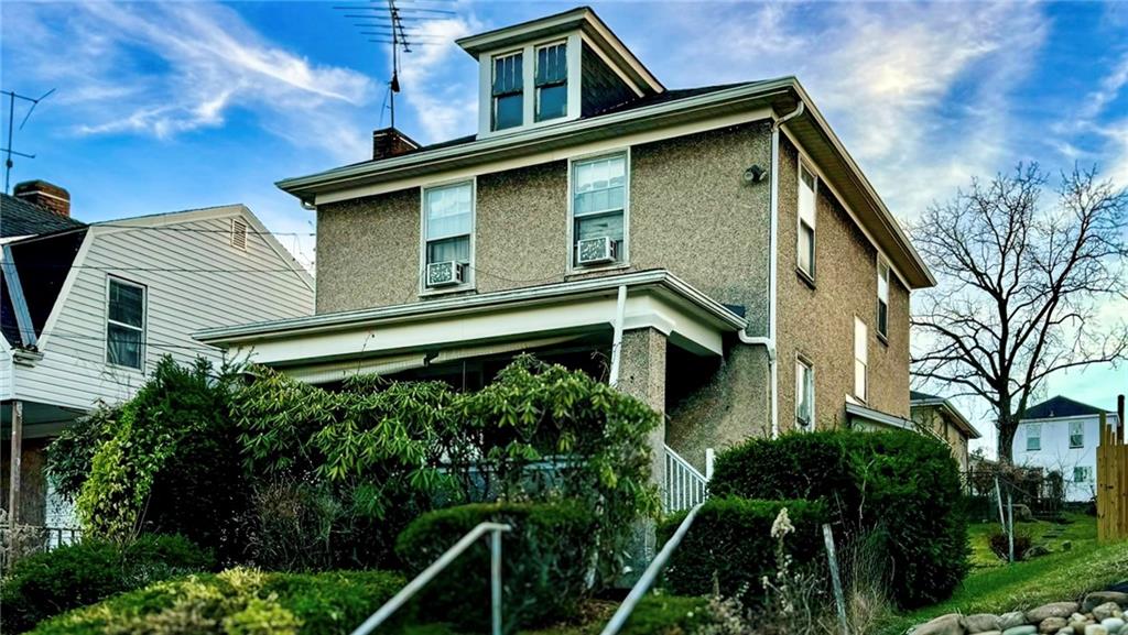 22 Reed Avenue Monessen, PA 15062 - Photo 2 of 2 a front view of a house with plants