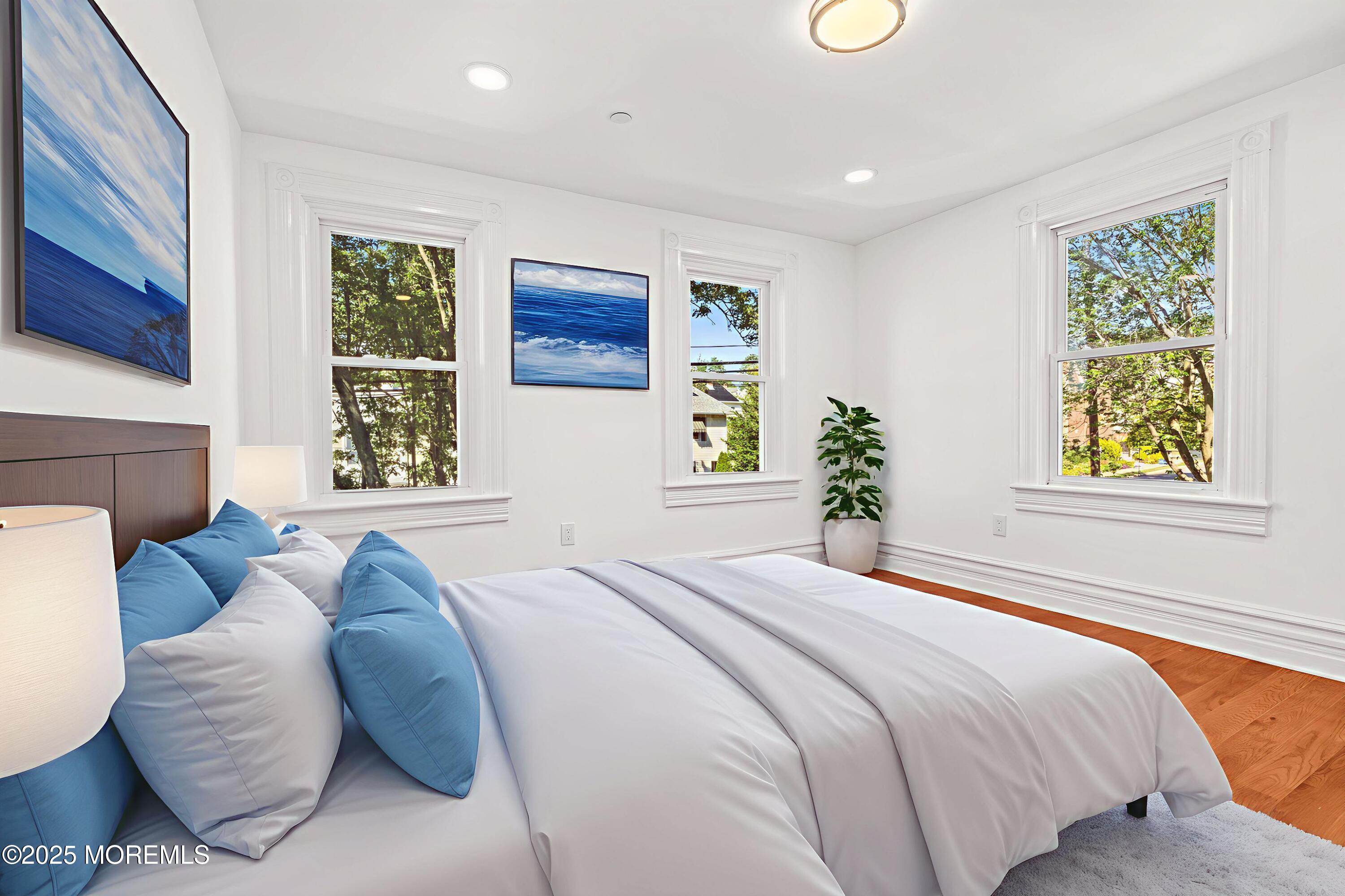 73 3rd Avenue, Unit C Atlantic Highlands, NJ 07716 - Photo 13 of 21 a bedroom with a bed and a window