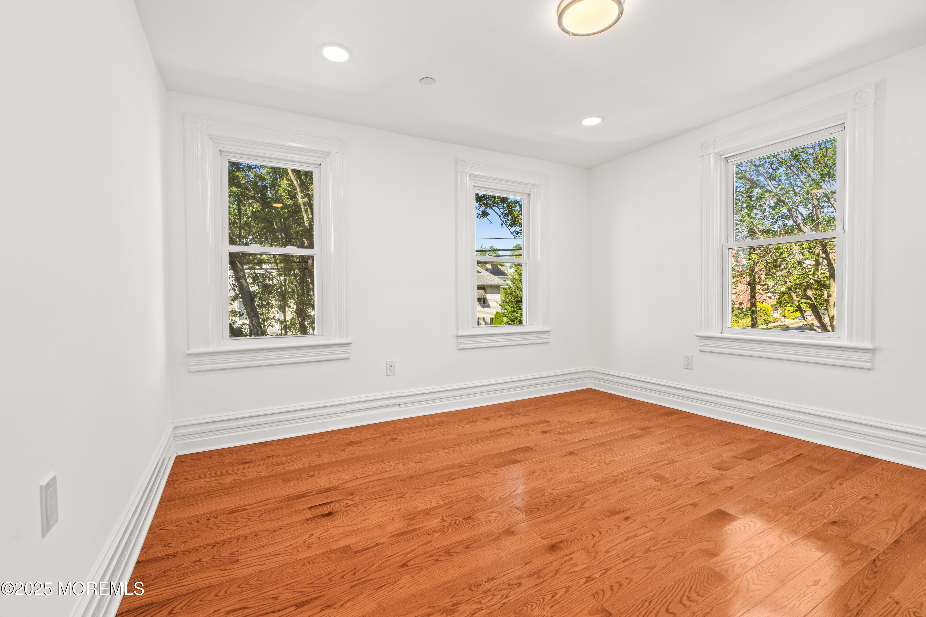 73 3rd Avenue, Unit C Atlantic Highlands, NJ 07716 - Photo 14 of 21 an empty room with windows