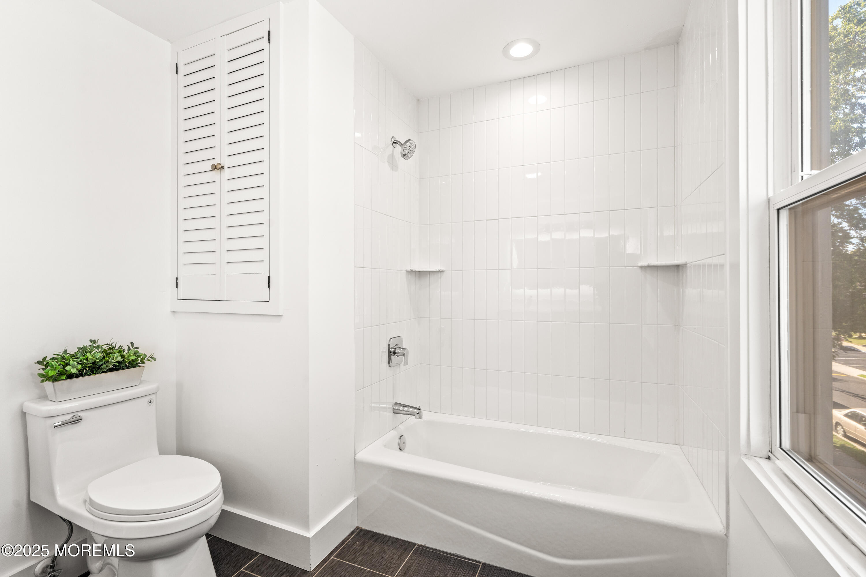 73 3rd Avenue, Unit C Atlantic Highlands, NJ 07716 - Photo 17 of 21 a bathroom with a toilet and a bathtub