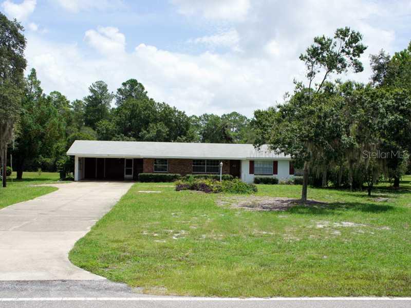 9661 Kilgore Road Orlando, FL 32836 - Photo 1 of 1 a backyard of a house with table and chairs