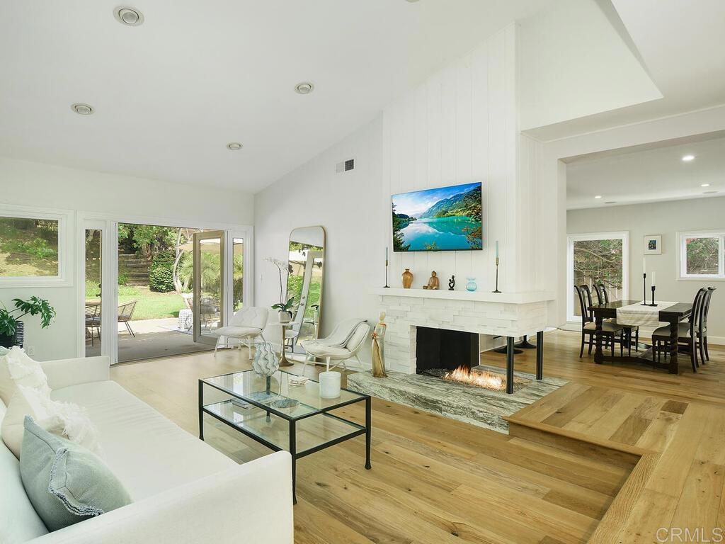 14146 Mango Drive Del Mar, CA 92014 - Photo 7 of 33 a living room with furniture and a fireplace