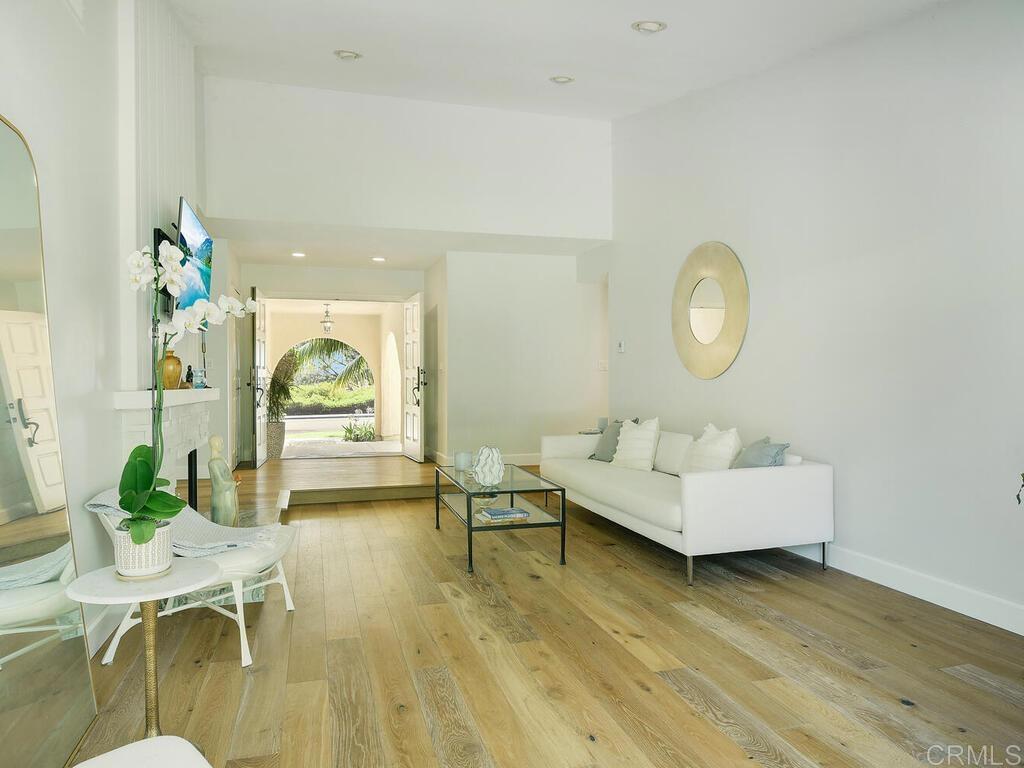 14146 Mango Drive Del Mar, CA 92014 - Photo 10 of 33 a living room with furniture and a wooden floor