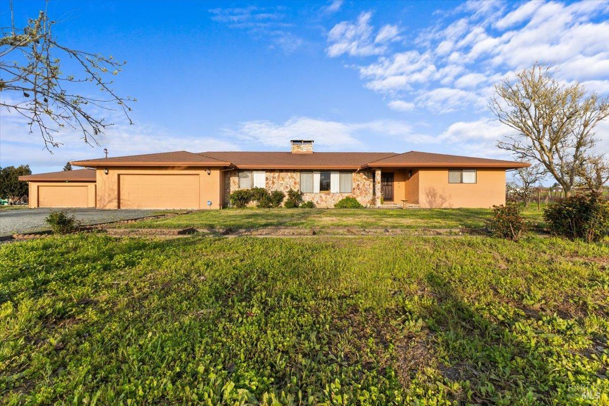 a view of a house with a big yard