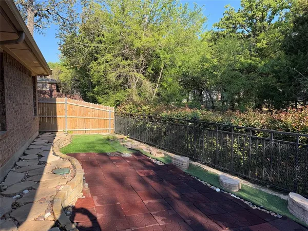 a backyard of a house with lots of green space