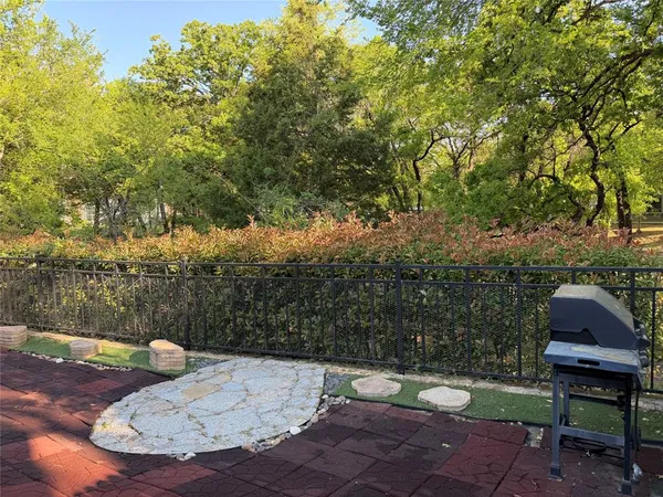 a view of a backyard with sitting area
