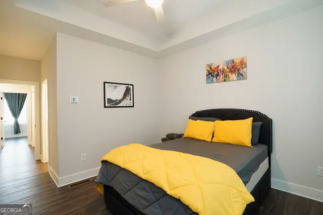 a bathroom with a shower a toilet and sink