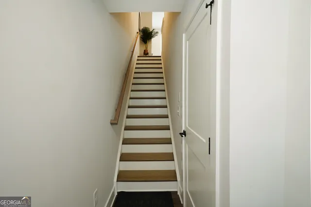 a view of a hallway with washer and dryer