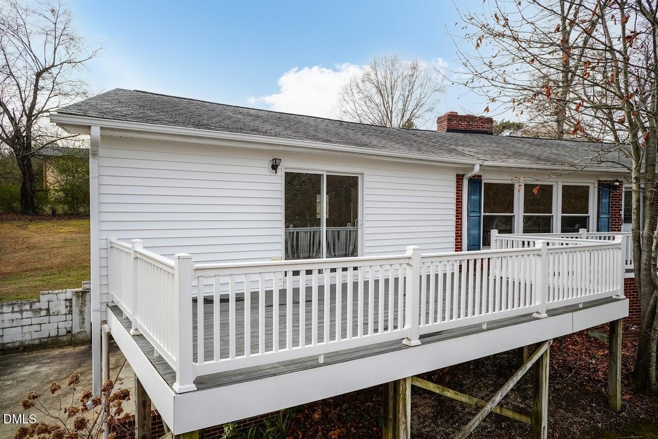 4000 Donna Road Raleigh, NC 27604 - Photo 13 of 58 a view of a deck with a chair and wooden floor