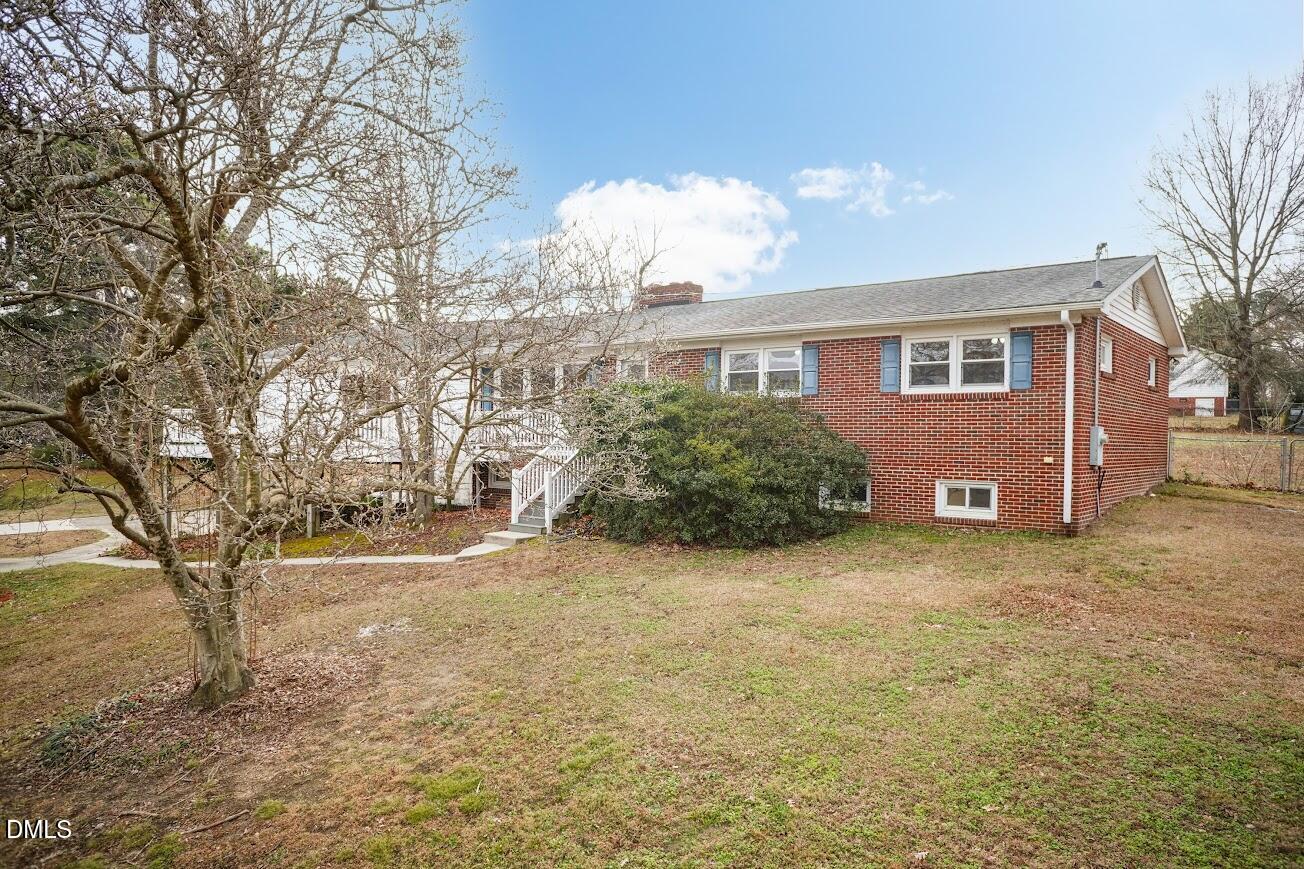 4000 Donna Road Raleigh, NC 27604 - Photo 2 of 58 a view of a house with a yard and garage