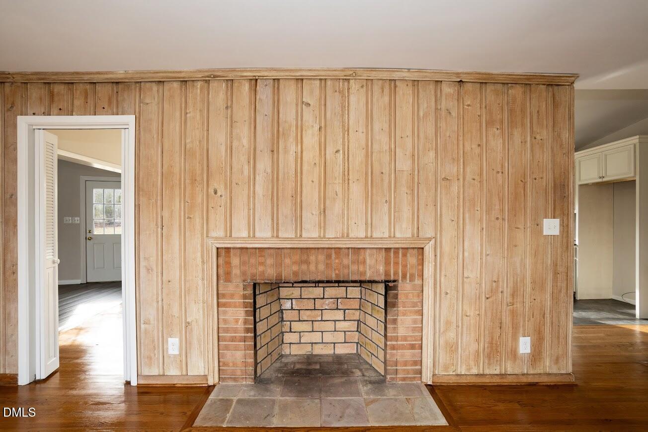 4000 Donna Road Raleigh, NC 27604 - Photo 21 of 58 a view of a livingroom with wooden floor and a fireplace
