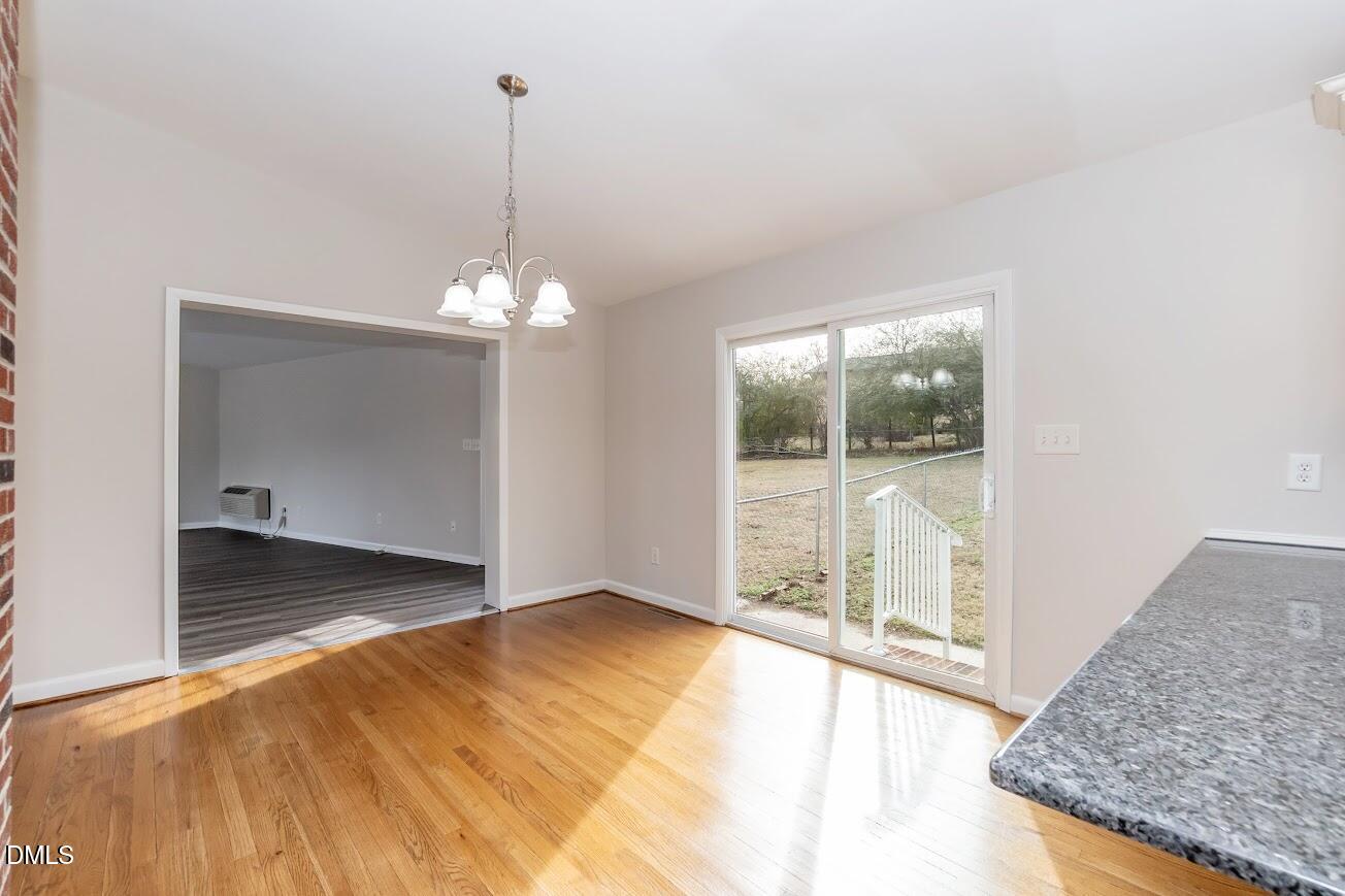 4000 Donna Road Raleigh, NC 27604 - Photo 28 of 58 a view of a room with window and chandelier