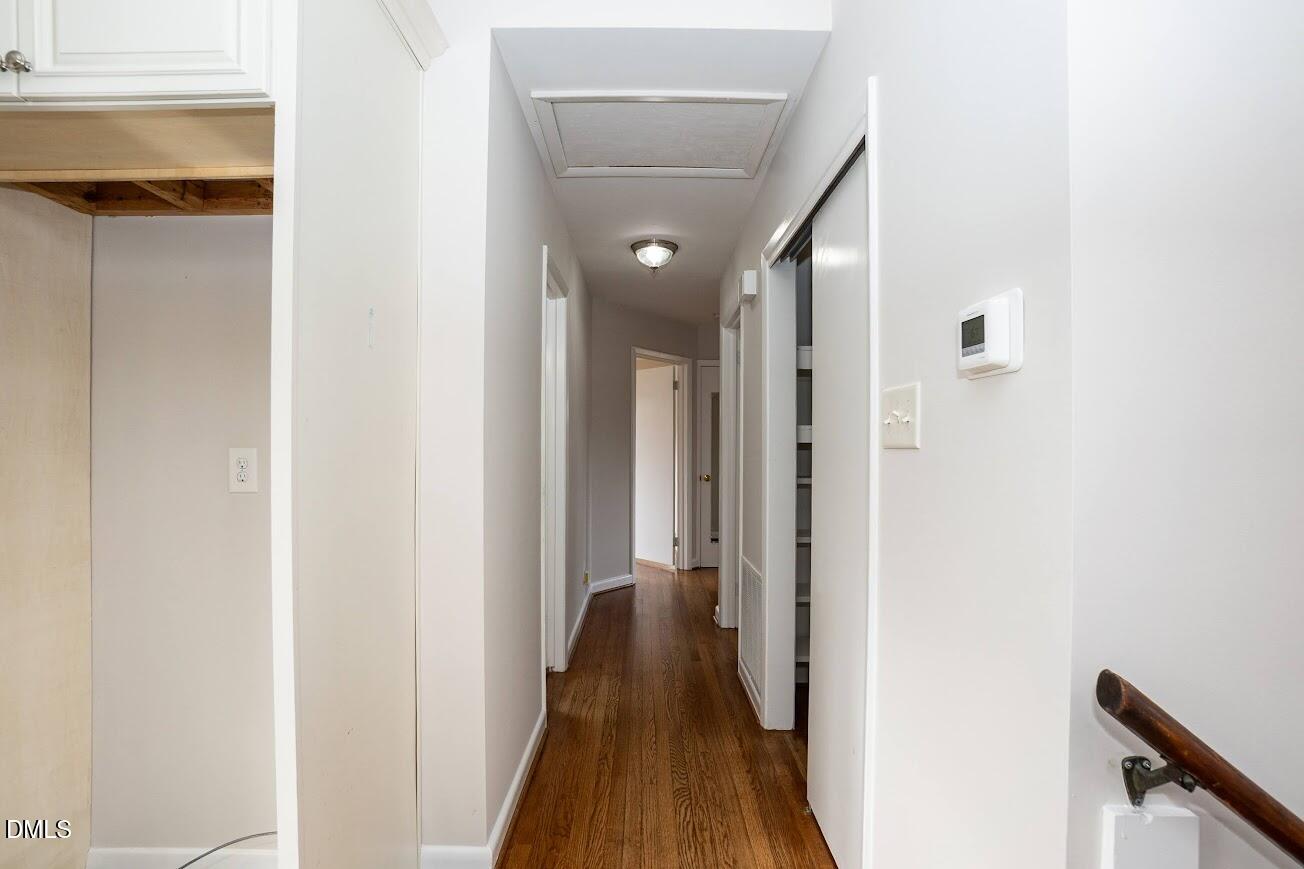 4000 Donna Road Raleigh, NC 27604 - Photo 31 of 58 a view of a hallway with wooden floor and staircase