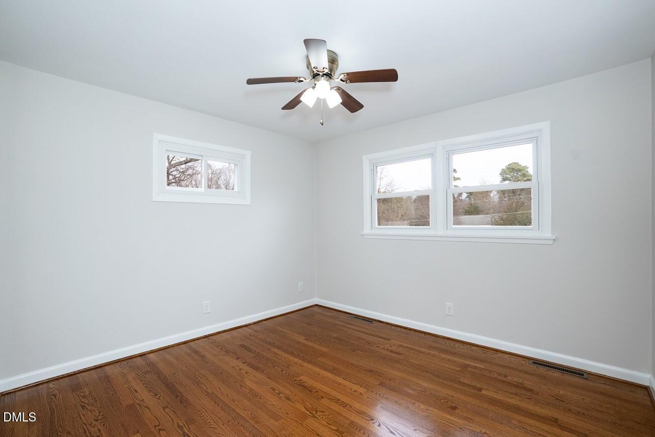 4000 Donna Road Raleigh, NC 27604 - Photo 34 of 58 a view of empty room with wooden floor and fan