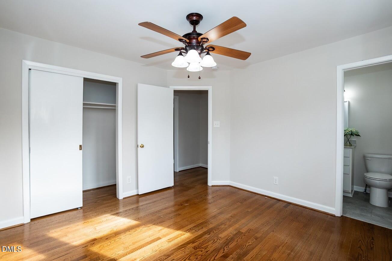 4000 Donna Road Raleigh, NC 27604 - Photo 37 of 58 a view of an empty room with wooden floor and a ceiling fan