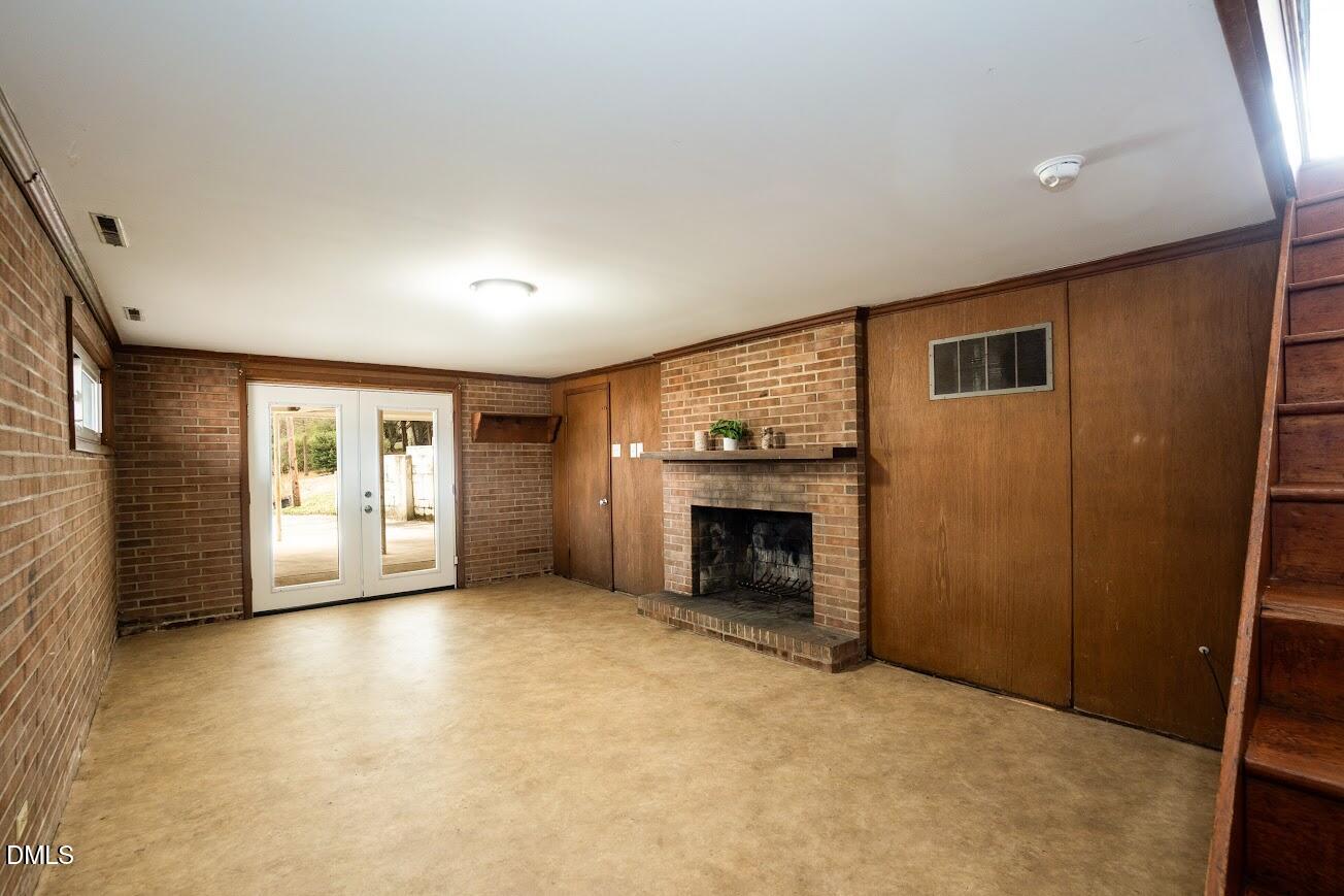 4000 Donna Road Raleigh, NC 27604 - Photo 42 of 58 an empty room with fireplace and windows
