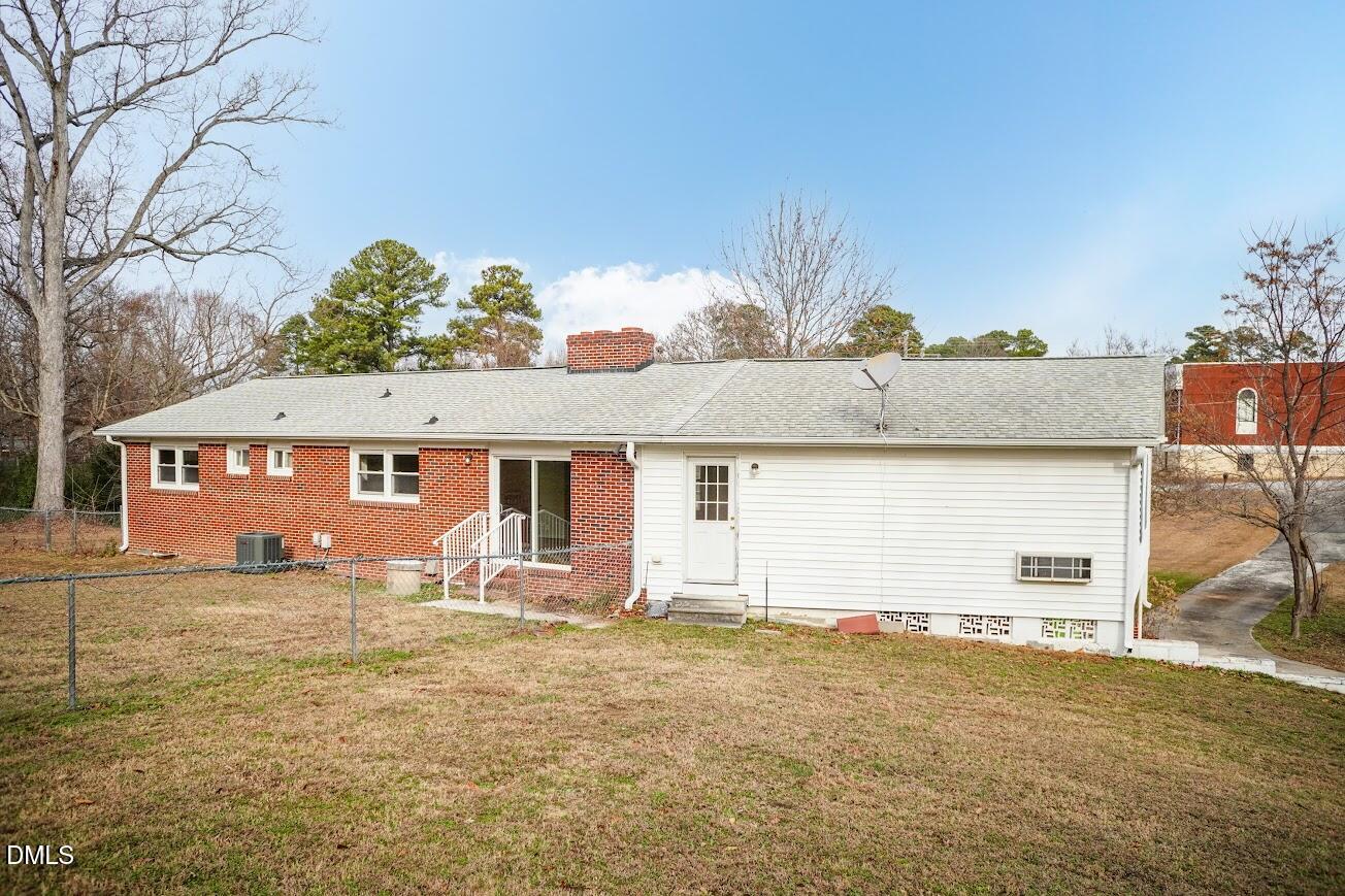 4000 Donna Road Raleigh, NC 27604 - Photo 54 of 58 a front view of a house with a yard