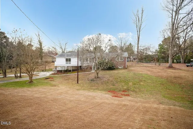 a balcony with table and chairs