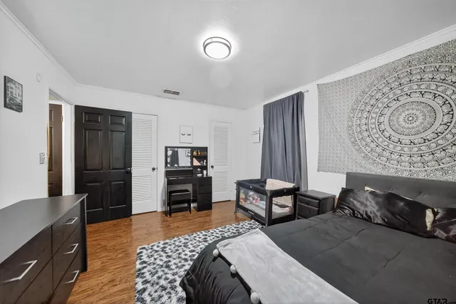 a bedroom with furniture and a bed