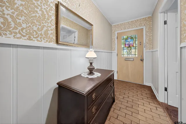 a kitchen with a sink and a refrigerator