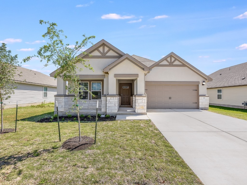 309 Windy Reed Road Hutto, TX 78634 - Photo 1 of 1 a view of a house with backyard porch and sitting area