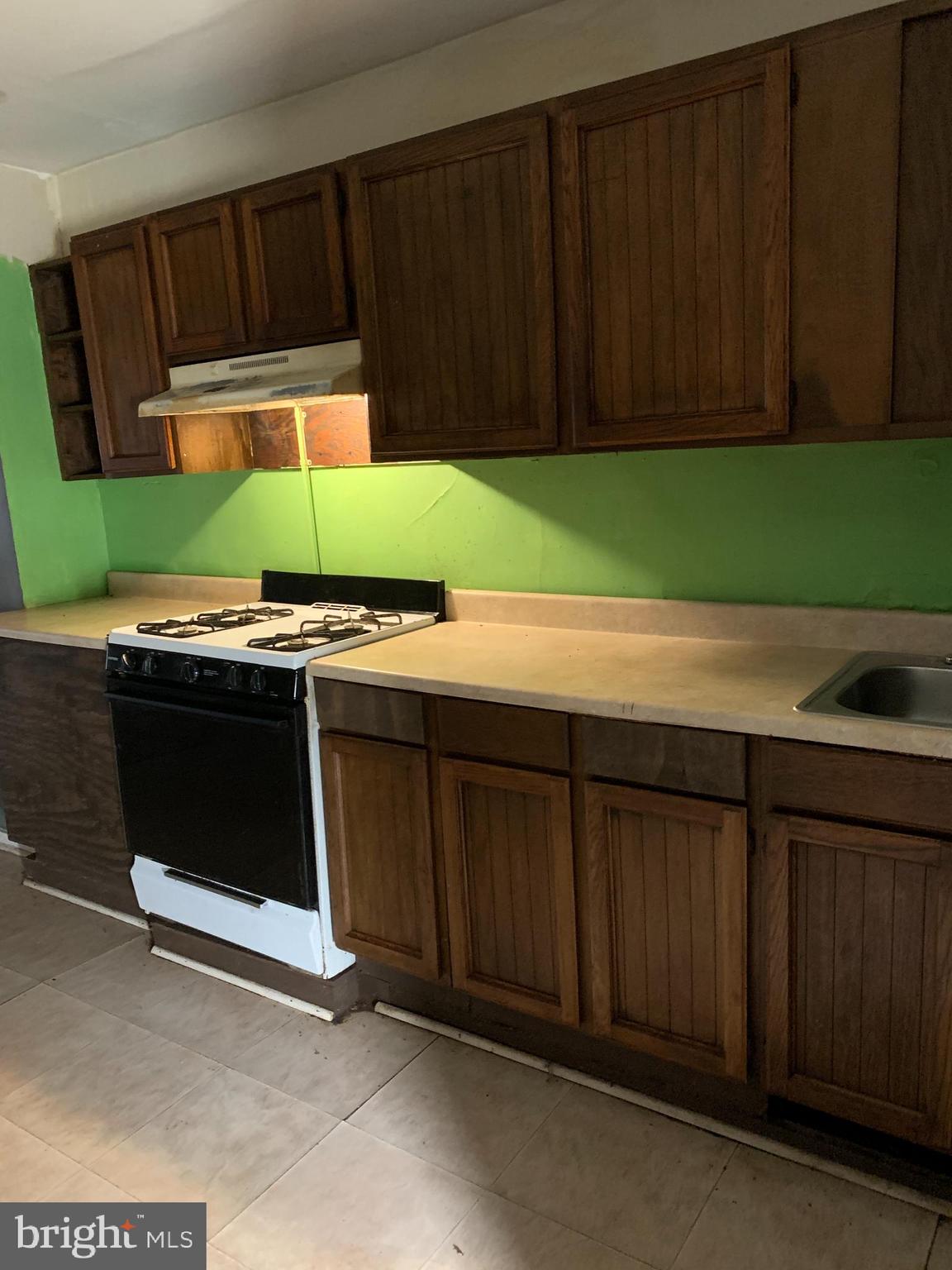 1825 Walbrook Avenue Baltimore, MD 21217 - Photo 5 of 13 a kitchen with a cabinets and a sink