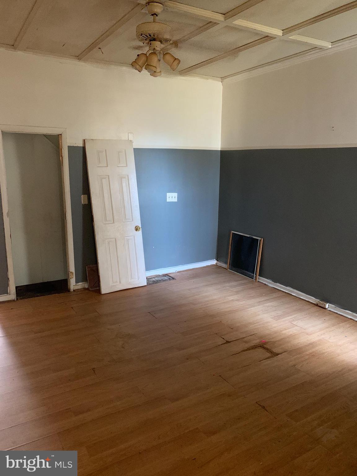1825 Walbrook Avenue Baltimore, MD 21217 - Photo 6 of 13 a view of a livingroom with a staircase