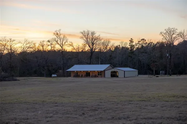a view of swimming pool with an outdoor seating