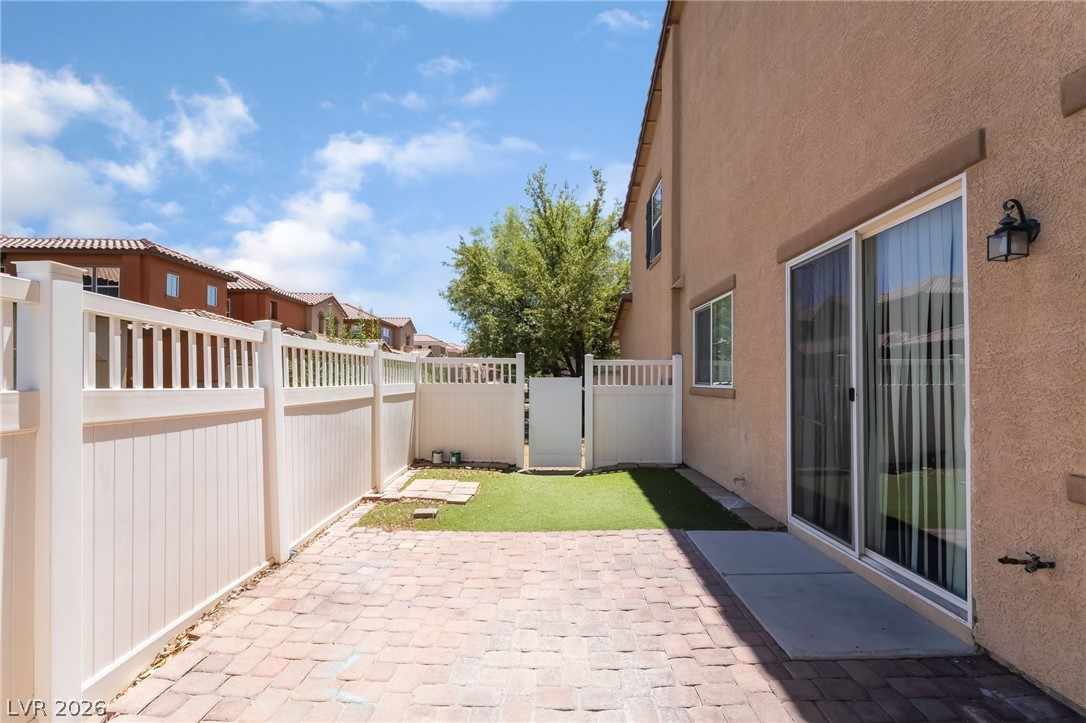 3175 Via Seranova Henderson, NV 89044 - Photo 35 of 45 This private outdoor space features a paved patio, fenced yard, and direct access to the interior.