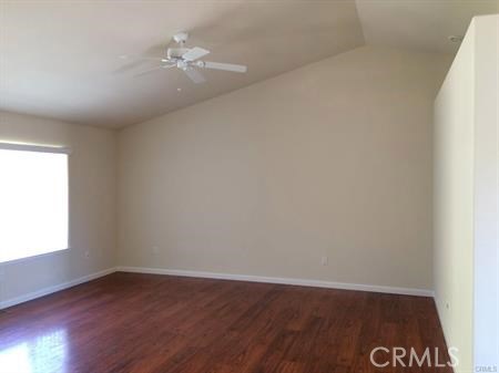 19111 Stonegate Road Hidden Valley Lake, CA 95467 - Photo 2 of 15 an empty room with wooden floor and a window