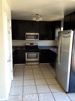 19111 Stonegate Road Hidden Valley Lake, CA 95467 - Photo 4 of 15 a kitchen with stainless steel appliances granite countertop a refrigerator and a stove