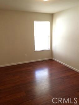19111 Stonegate Road Hidden Valley Lake, CA 95467 - Photo 7 of 15 an empty room with wooden floor and windows