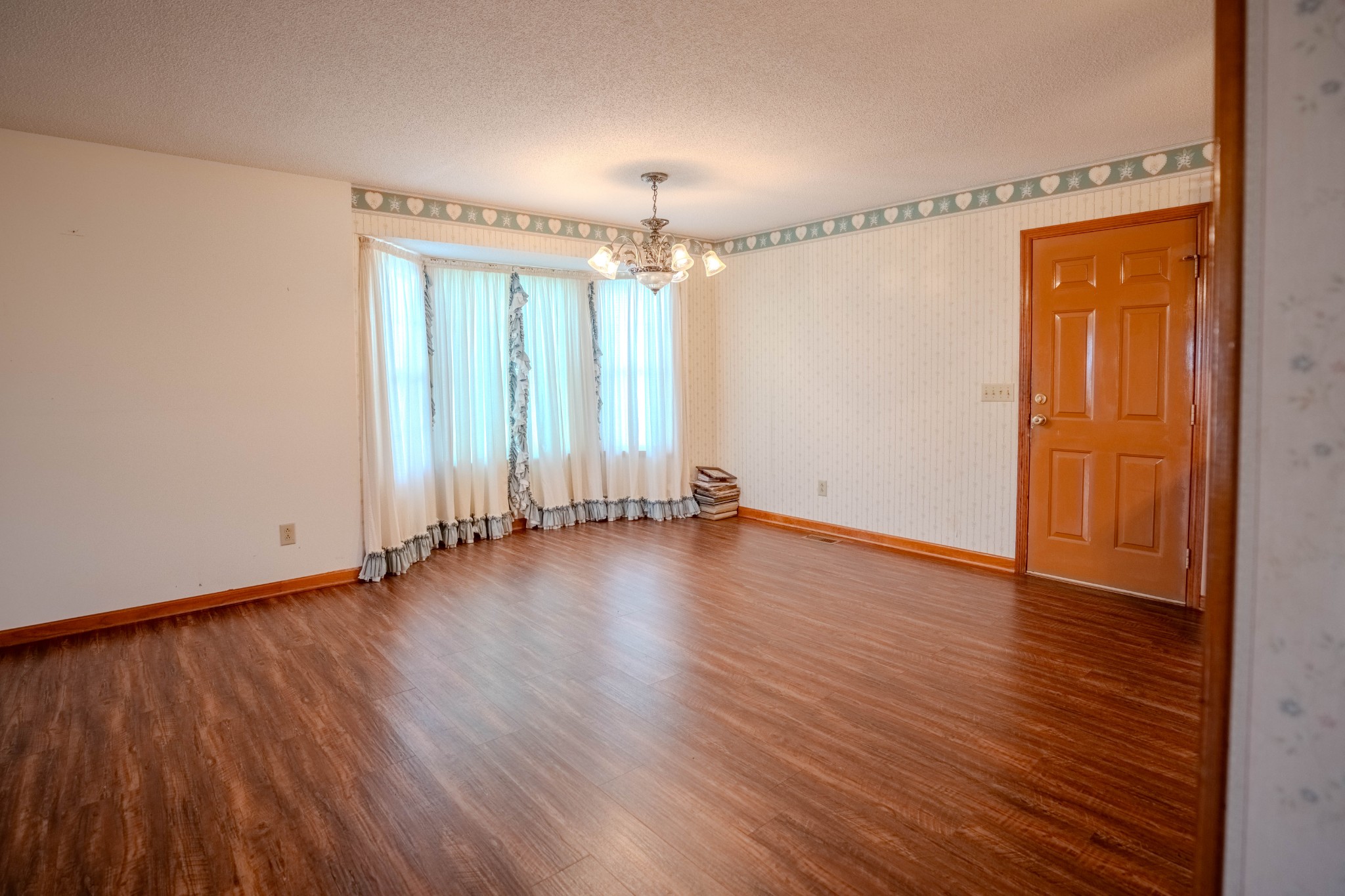 145 Lantz Road Lawrenceburg, TN 38464 - Photo 24 of 42 an empty room with wooden floor and windows