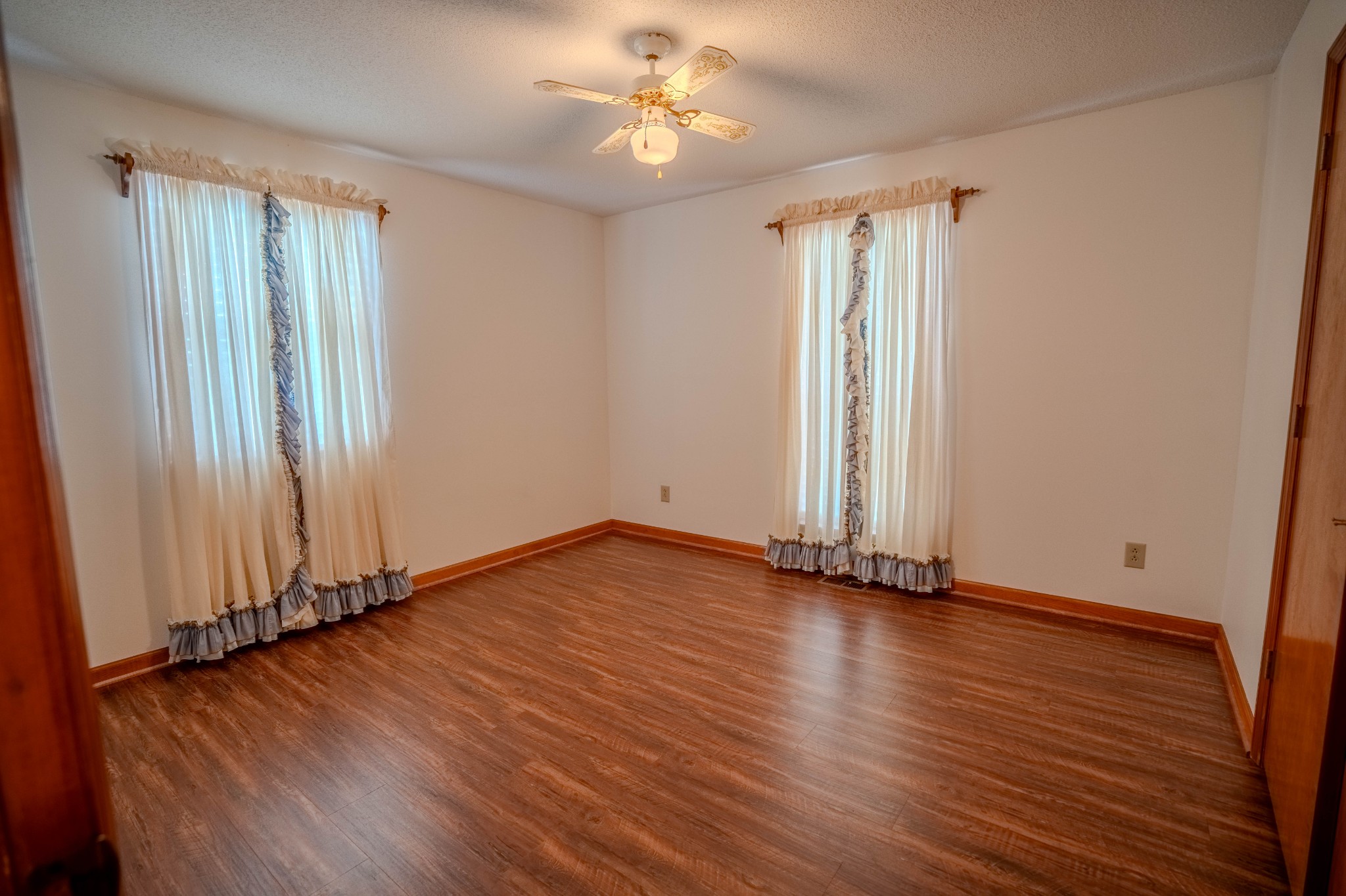 145 Lantz Road Lawrenceburg, TN 38464 - Photo 30 of 42 an empty room with wooden floor and windows