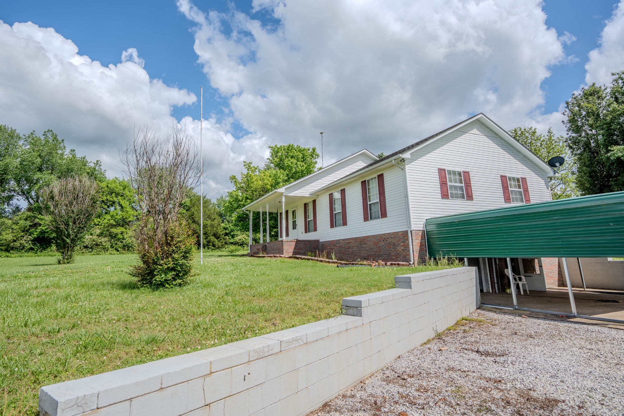 145 Lantz Road Lawrenceburg, TN 38464 - Photo 8 of 42 a house view with a garden space